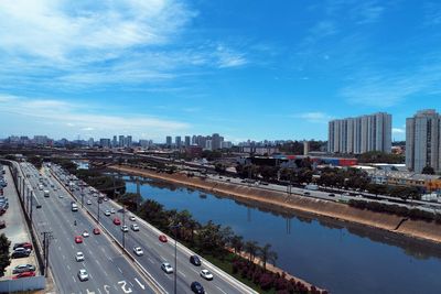 High angle view of city street and buildings against sky