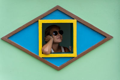 Portrait of boy against blue background