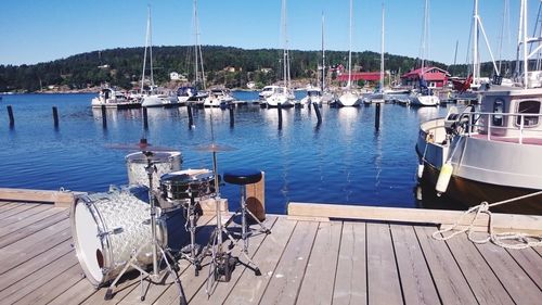 Boats moored at harbor
