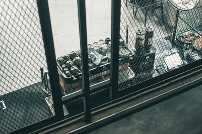 Close-up of window on metal fence