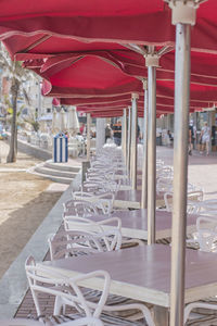 Empty chairs and tables in restaurant