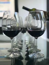 Close-up of wine in glasses arranged on table