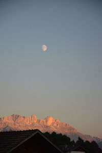 Scenic view of snowcapped mountains against sky at dusk