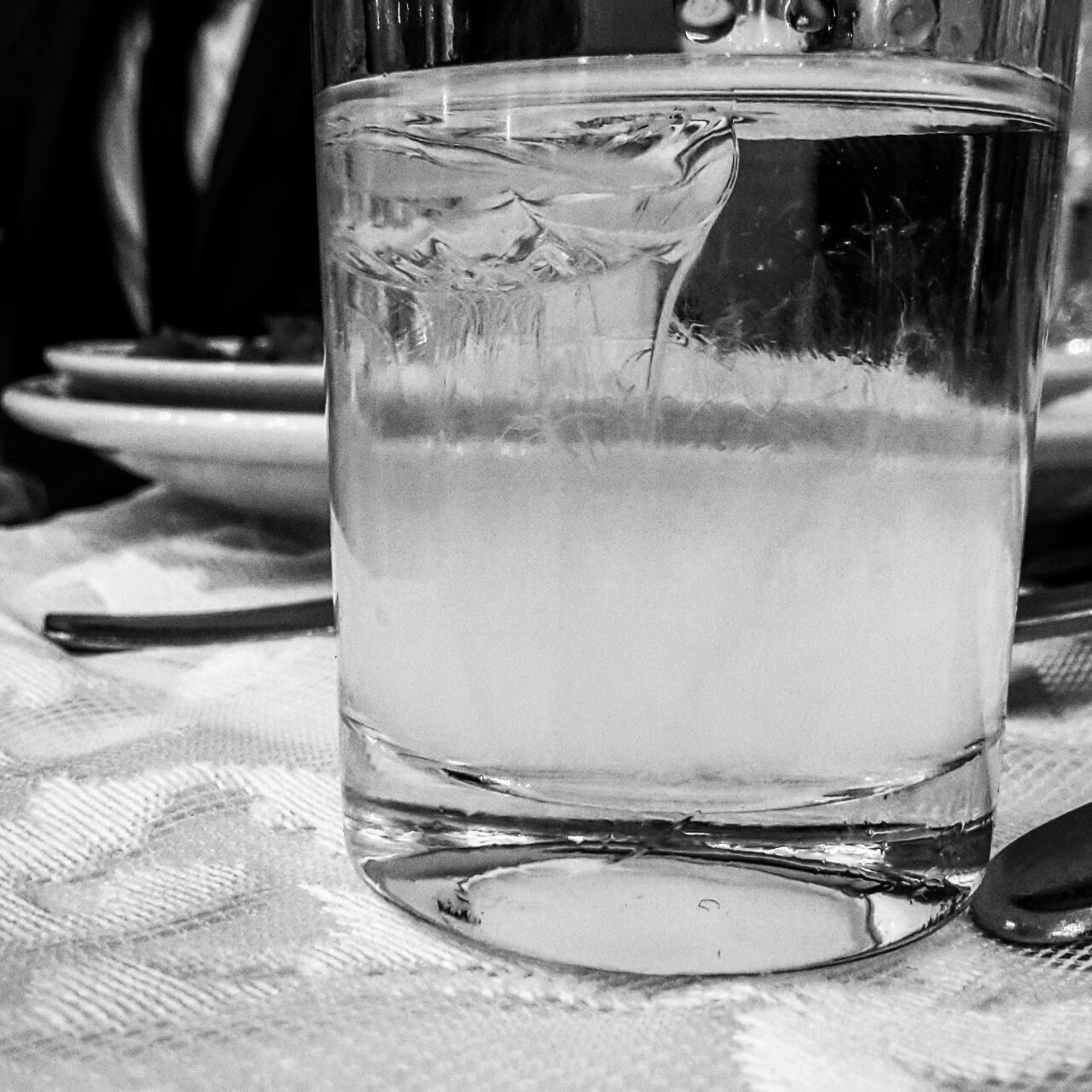 refreshment, food and drink, drink, drinking glass, table, indoors, glass - material, transparent, close-up, still life, freshness, focus on foreground, glass, water, purity, no people, beverage, non-alcoholic beverage, cold drink
