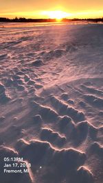 Scenic view of beach against sky during sunset