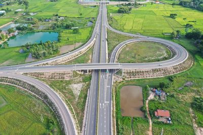 High angle view of road amidst plants in city