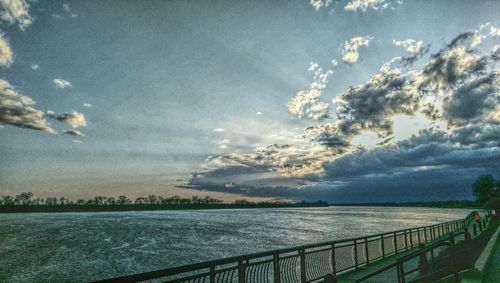 Scenic view of sea against cloudy sky