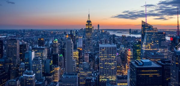 Aerial view of city at sunset