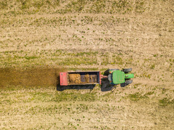 Tractor in row on field