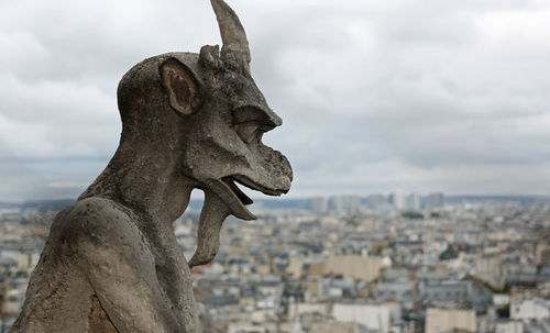 Gargoyle the mythical winged monster on the cathedral of notre dame in paris