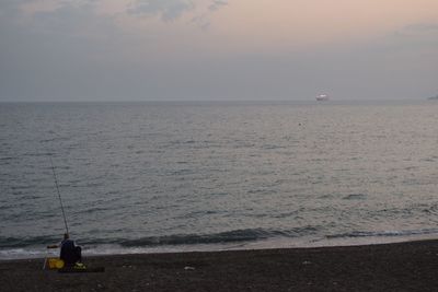 Scenic view of sea against sky at sunset