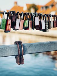 Close-up of padlocks hanging on railing