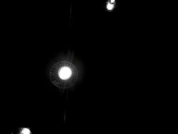 Low angle view of illuminated light bulb