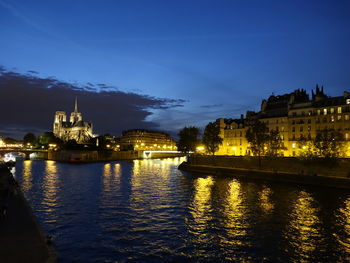 Illuminated buildings at waterfront