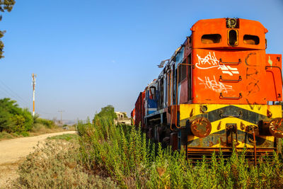Train on railroad track against sky