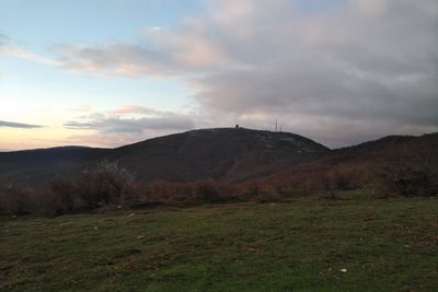 Scenic view of field against sky during sunset