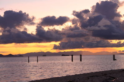 Scenic view of dramatic sky over sea during sunset