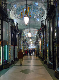 People in illuminated building