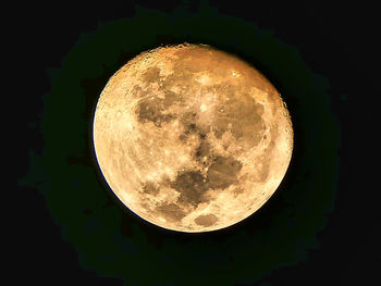 Low angle view of moon against sky at night