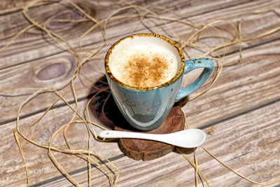 High angle view of coffee cup on table