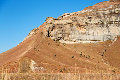 Scenic view of rocky mountains against clear sky