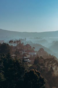 High angle view of built structures against clear sky