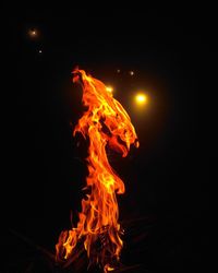 Close-up of bonfire on field at night