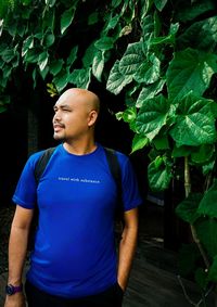 Smiling young woman standing outdoors