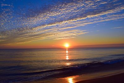 Scenic view of sea at sunset