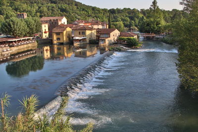 River amidst houses and buildings