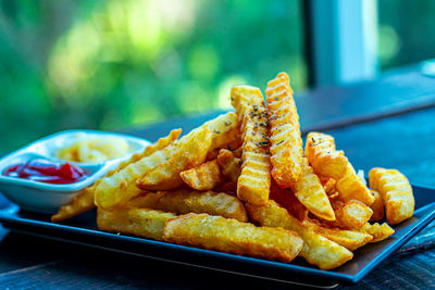 Crispy crinkle cut french fries irresistible potatoes with delicious sauce