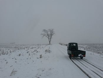 Scenic view of snow covered landscape against clear sky