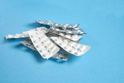 High angle view of ice cream on table against blue background