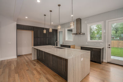 New kitchen island and countertops have been installed during a kitchen renovation