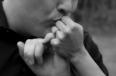 Close-up of man kissing hand of woman