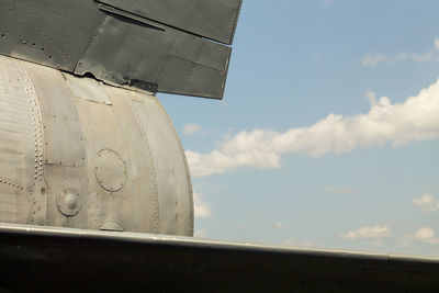 Low angle view of airplane flying against sky