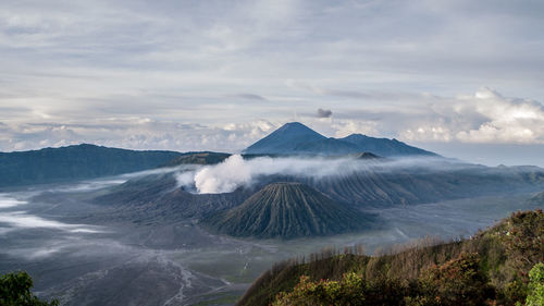 Scenic view of volcanic landscape against sky