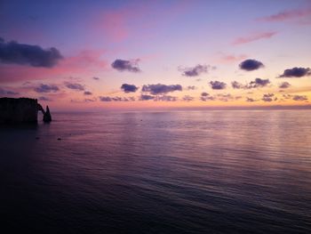 Scenic view of sea against sky at sunset