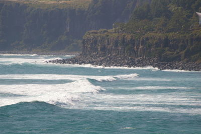 Scenic view of sea against mountains