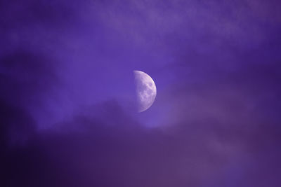 Low angle view of moon against sky at night