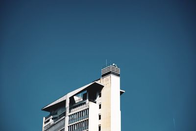 Low angle view of building against blue sky