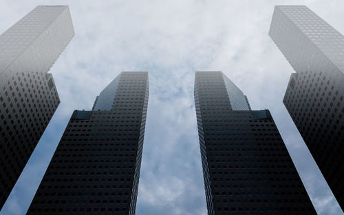 Low angle view of buildings against sky in city