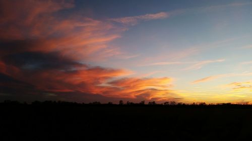 Scenic view of silhouette landscape against sky during sunset