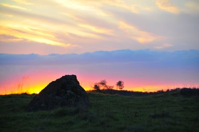 Scenic view of landscape against sky during sunset