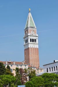 Low angle view of bell tower against sky