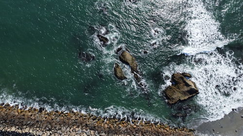 High angle view of people swimming in sea