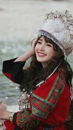 Young woman wearing miao traditional silver hat