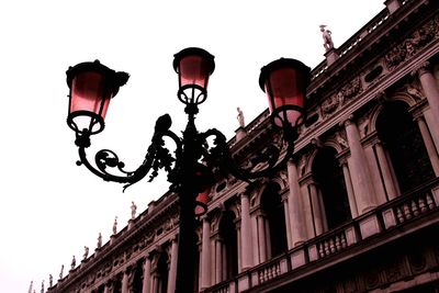 Low angle view of street light against sky