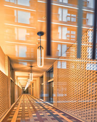 Empty road amidst buildings in city