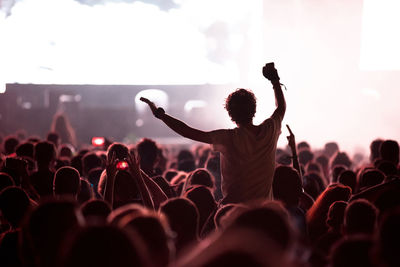 Rear view of people enjoying music concert